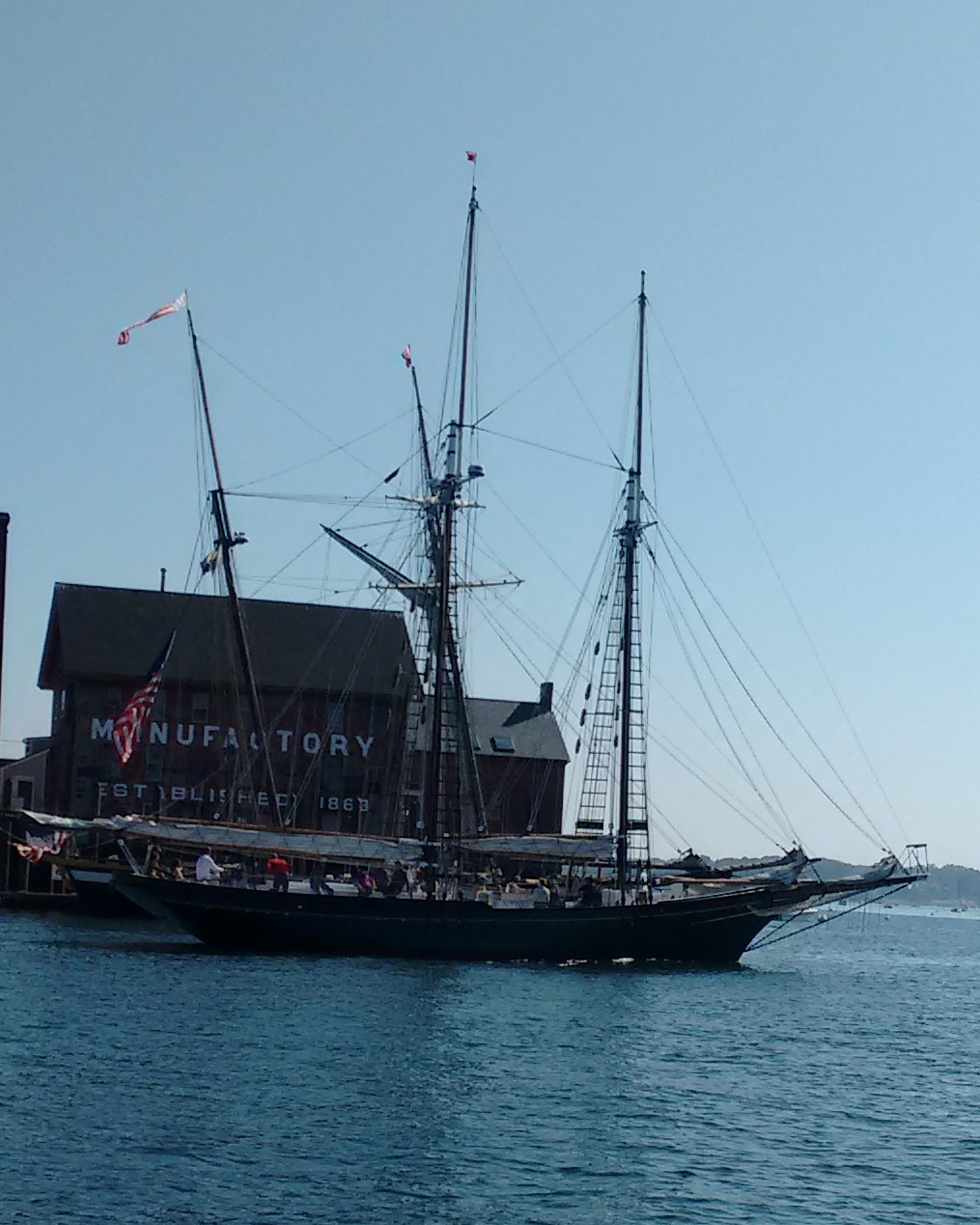 A schooner heading out of Gloucester harbor