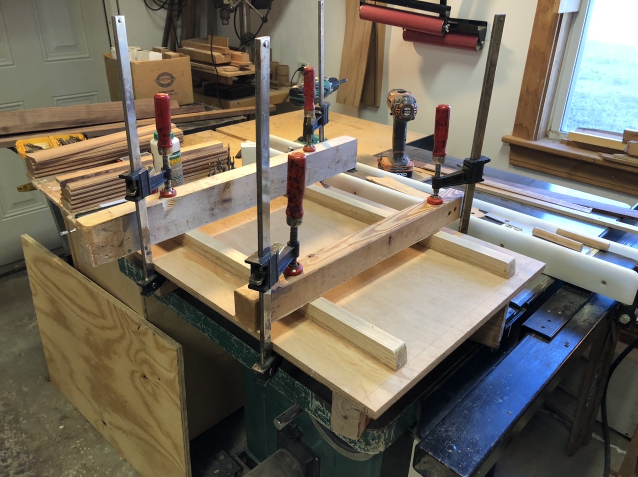 I glued, screwed, and clamped the oak cleats to the back of the plywood.