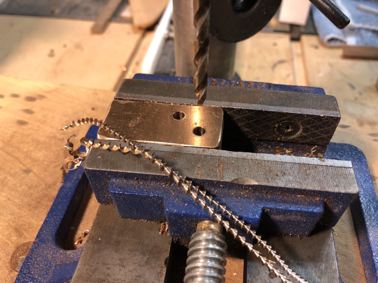 When you are drilling bronze you want the metal to come off in spirals just like this. Means the bit is sharp and you are not cutting too fast.