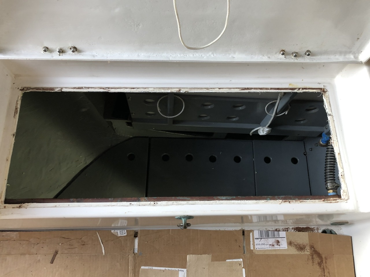 Looking down into the port locker with the frame just removed.