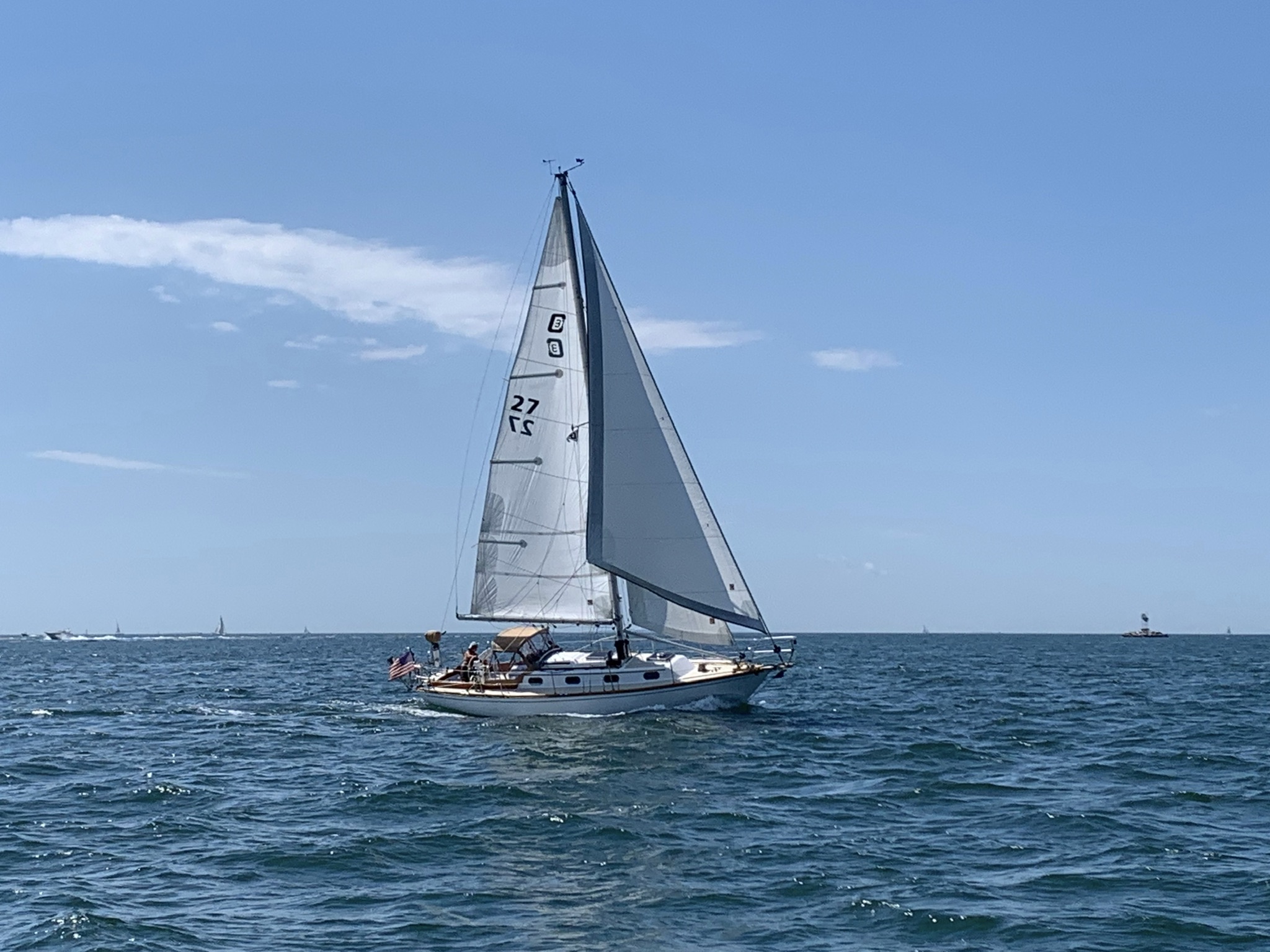 Orion under sail last season. You should be able to see the lazy jacks in use.