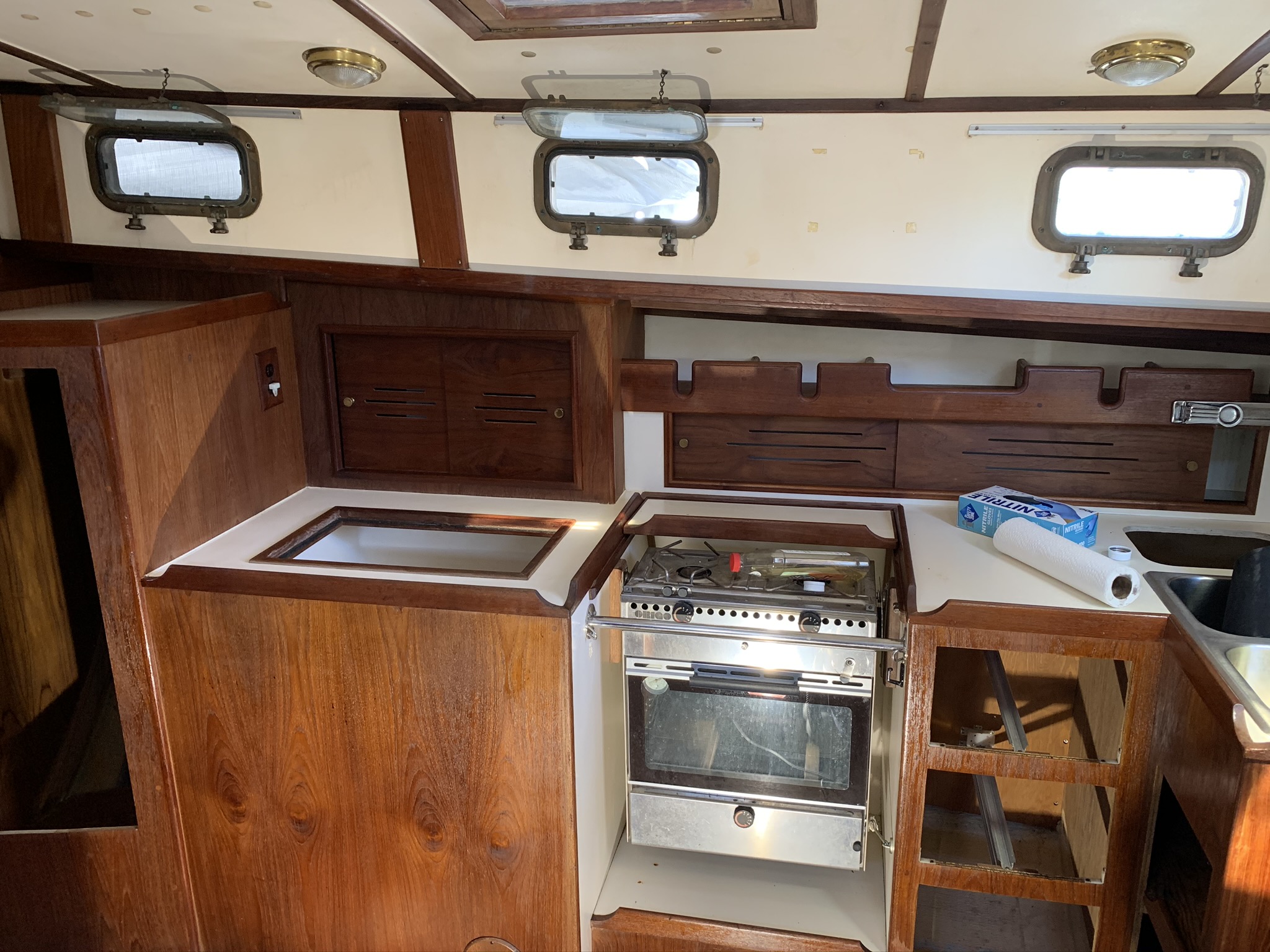 During restoration. Drawers removed for detail work and all new drawer bases installed.