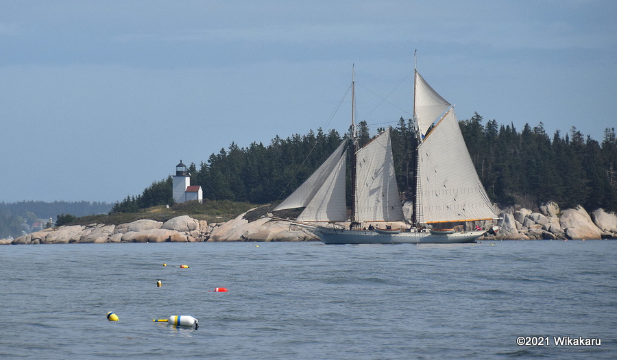 Schooner Mary Day sails past the Deer Isle Thorofare Lighthouse on Mark Island