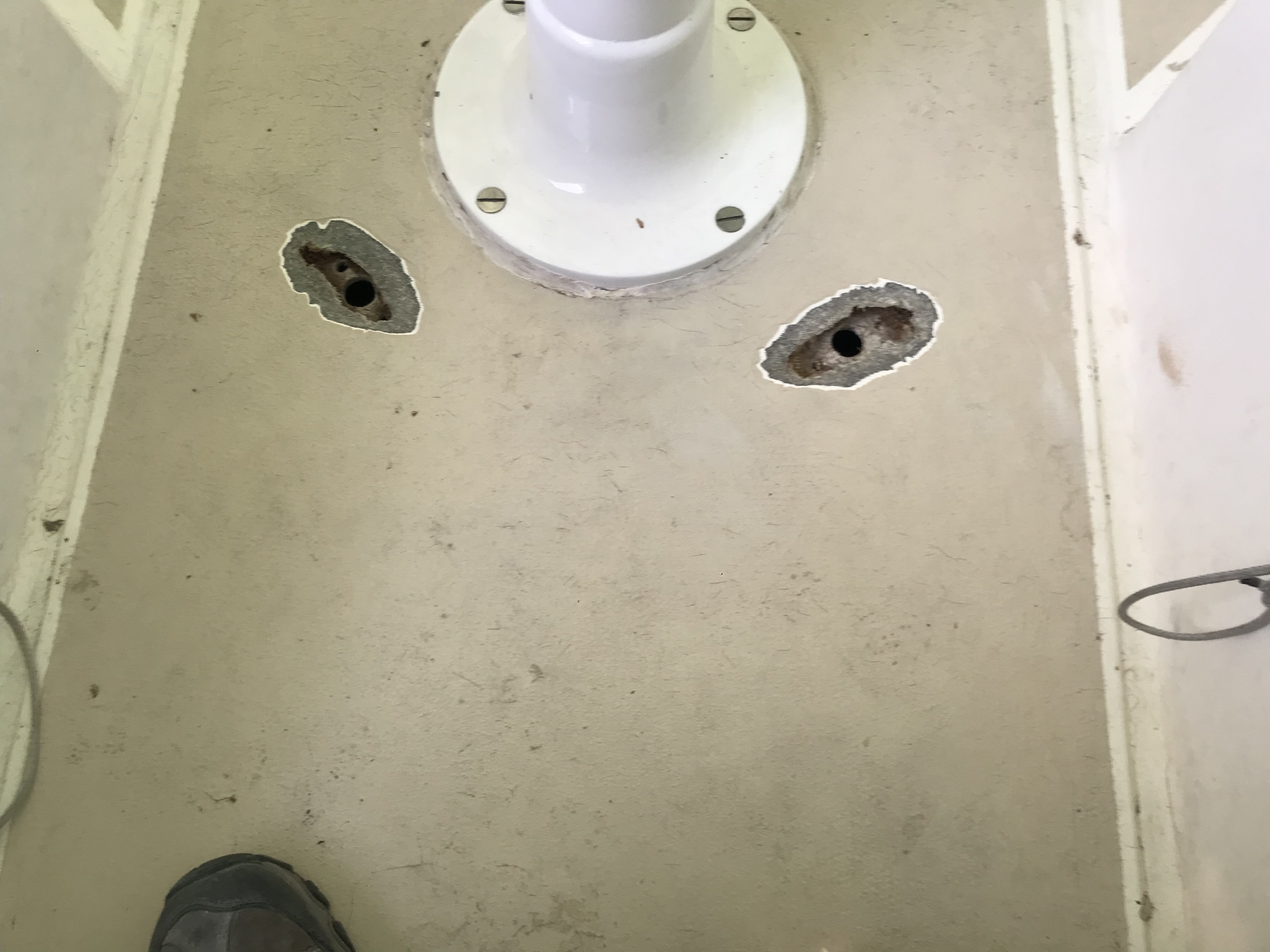 Old pedestal guard mounting holes ground out awaiting glass and gel coat.