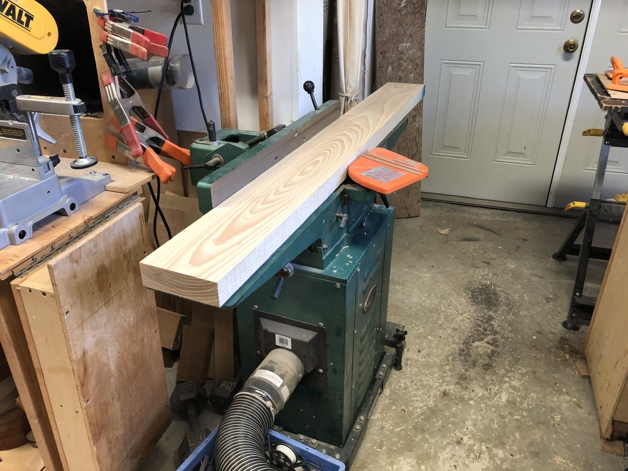 The 5' plank run over the jointer. This is a staged photo after I milled it. But, it depicts the milling process.