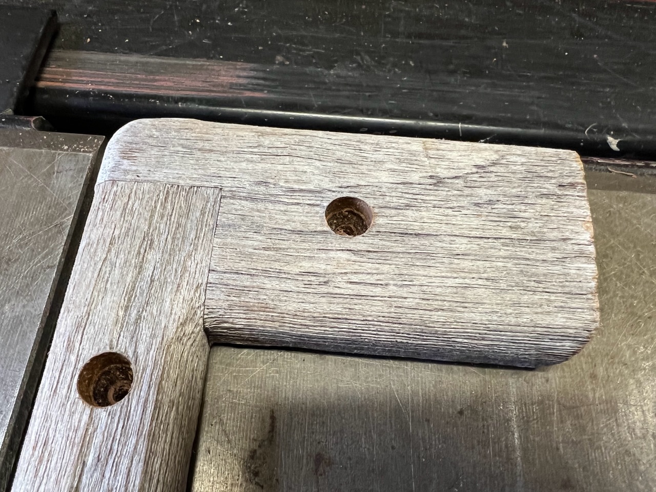 Port side teak cap which covers the top edge of the coaming.