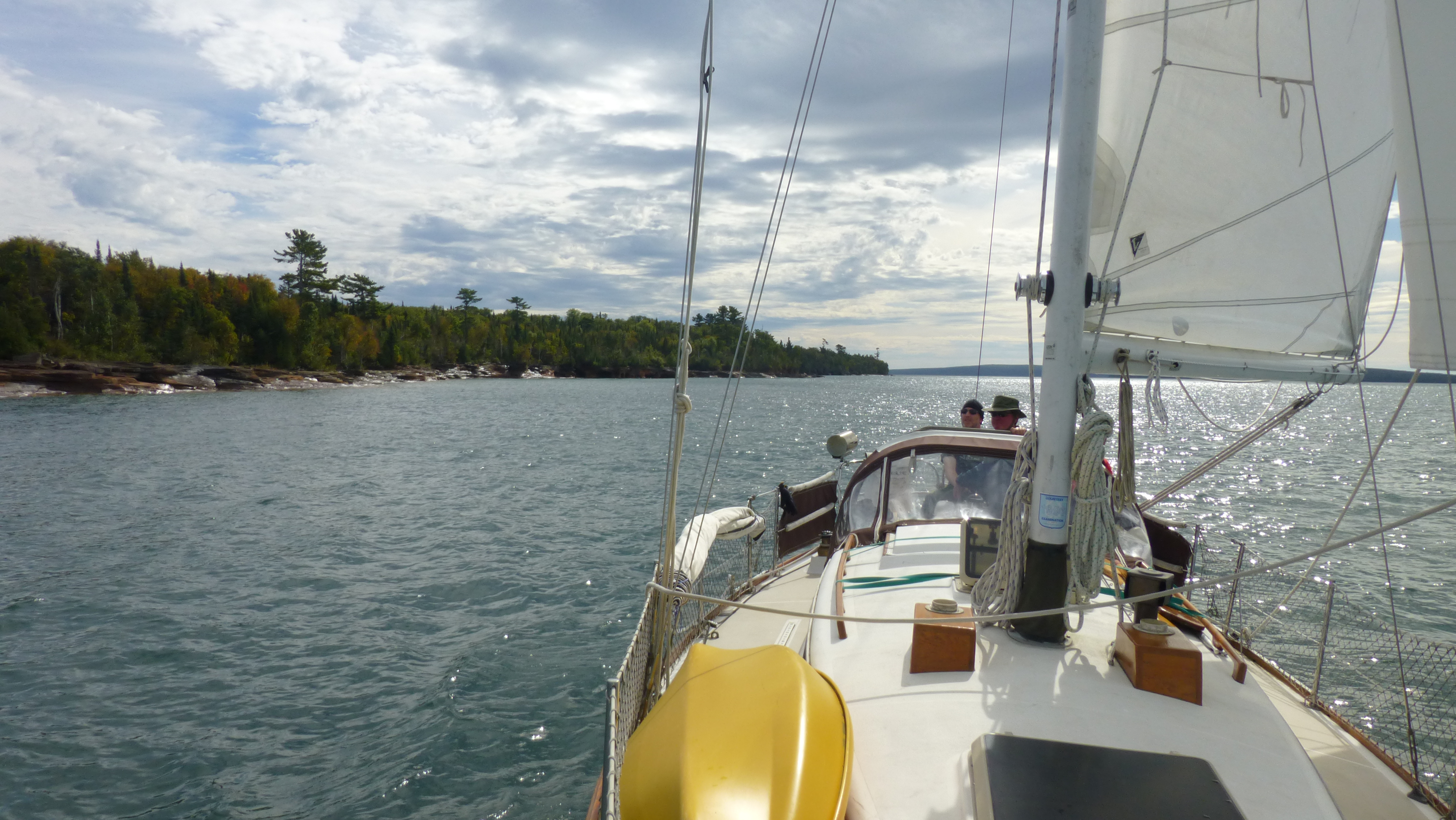 Femme sailing around the Devil's Island sea caves.