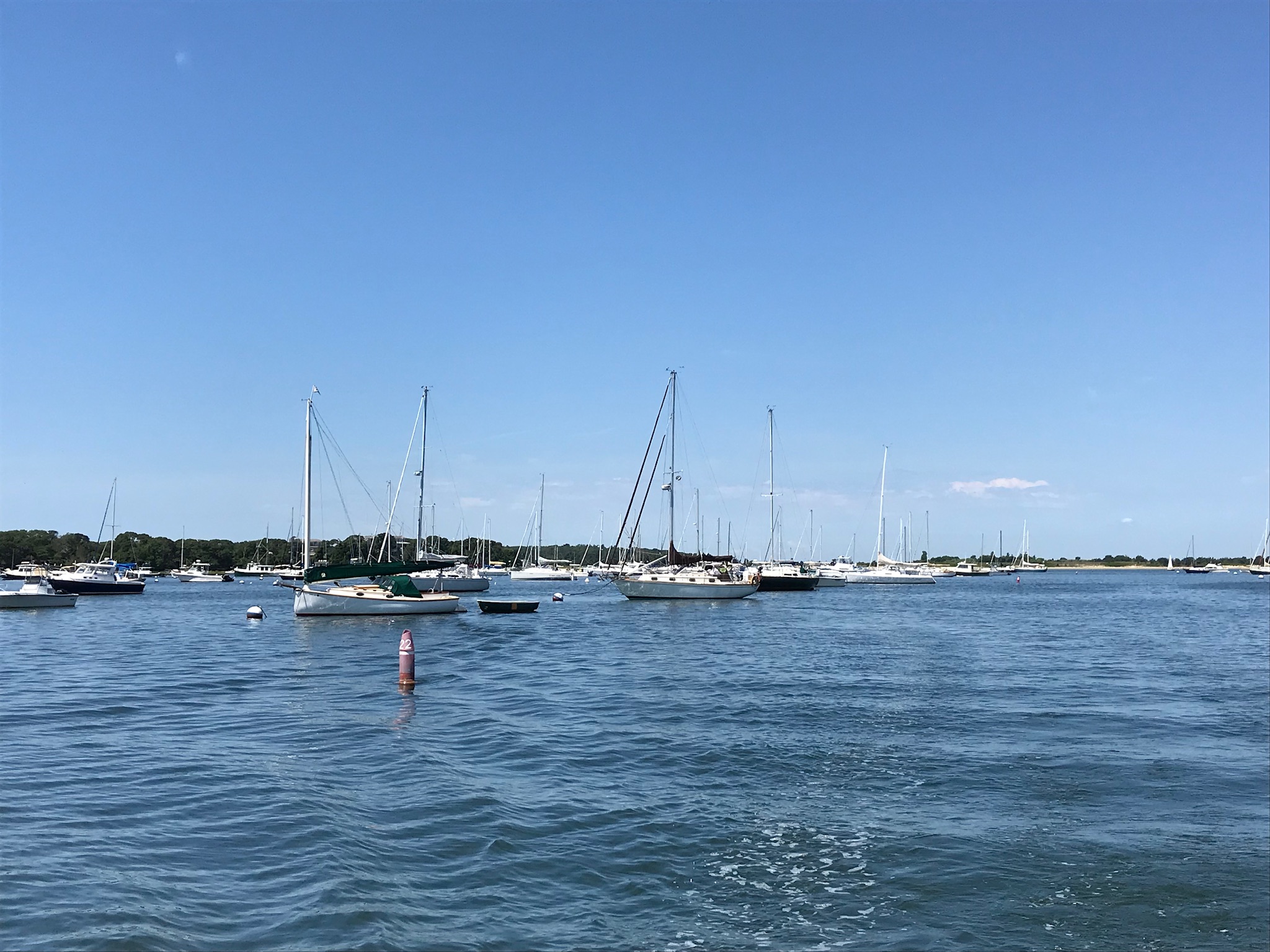 Realization swinging on a mooring at Parker’s Boat Yard, Red Brook Harbor, Cataumet, MA