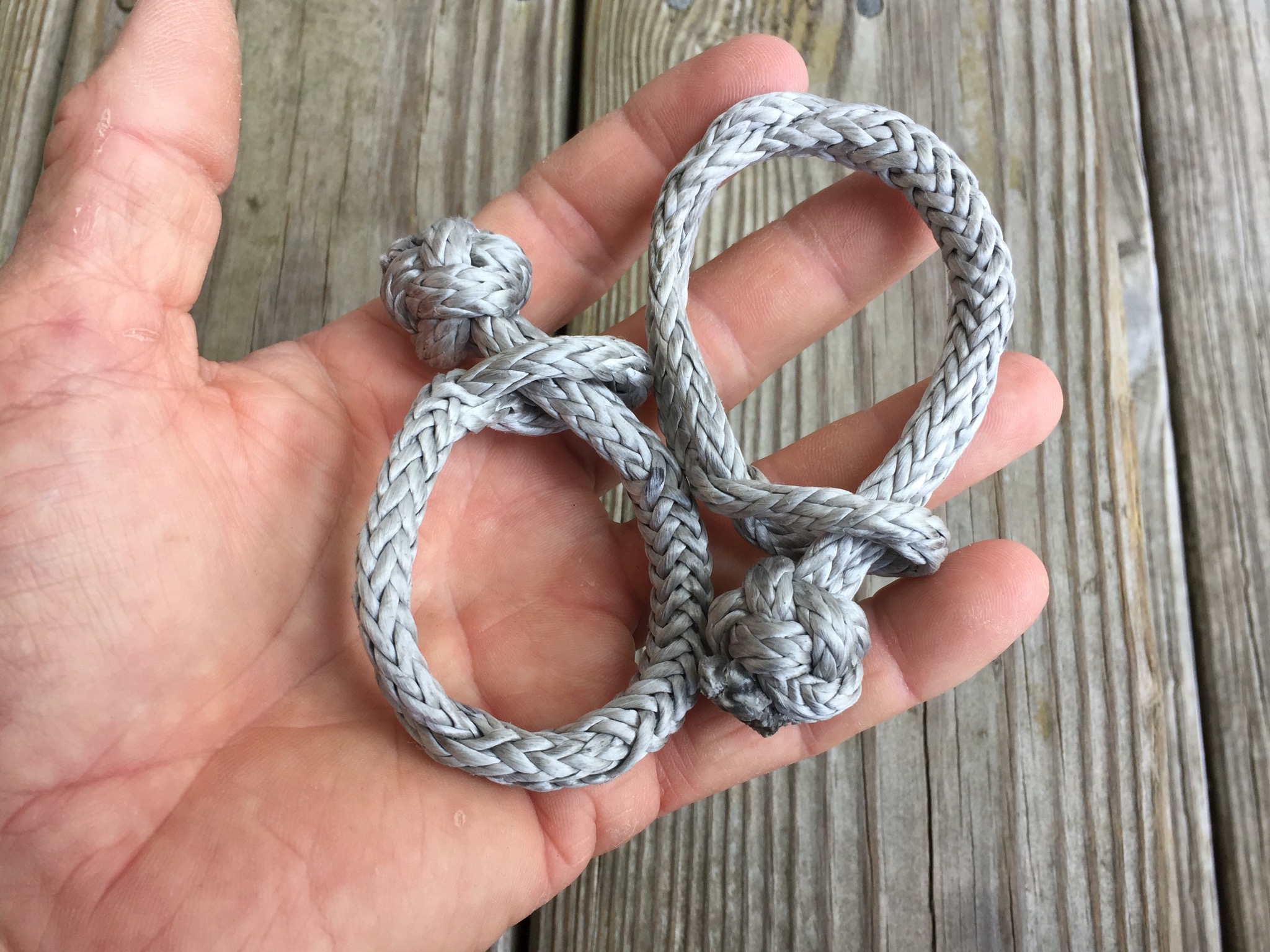 Dyneema soft shackles are quick and easy to make. They are much stronger than SS. These 1/4” shackles should break around 8,000 lbs.