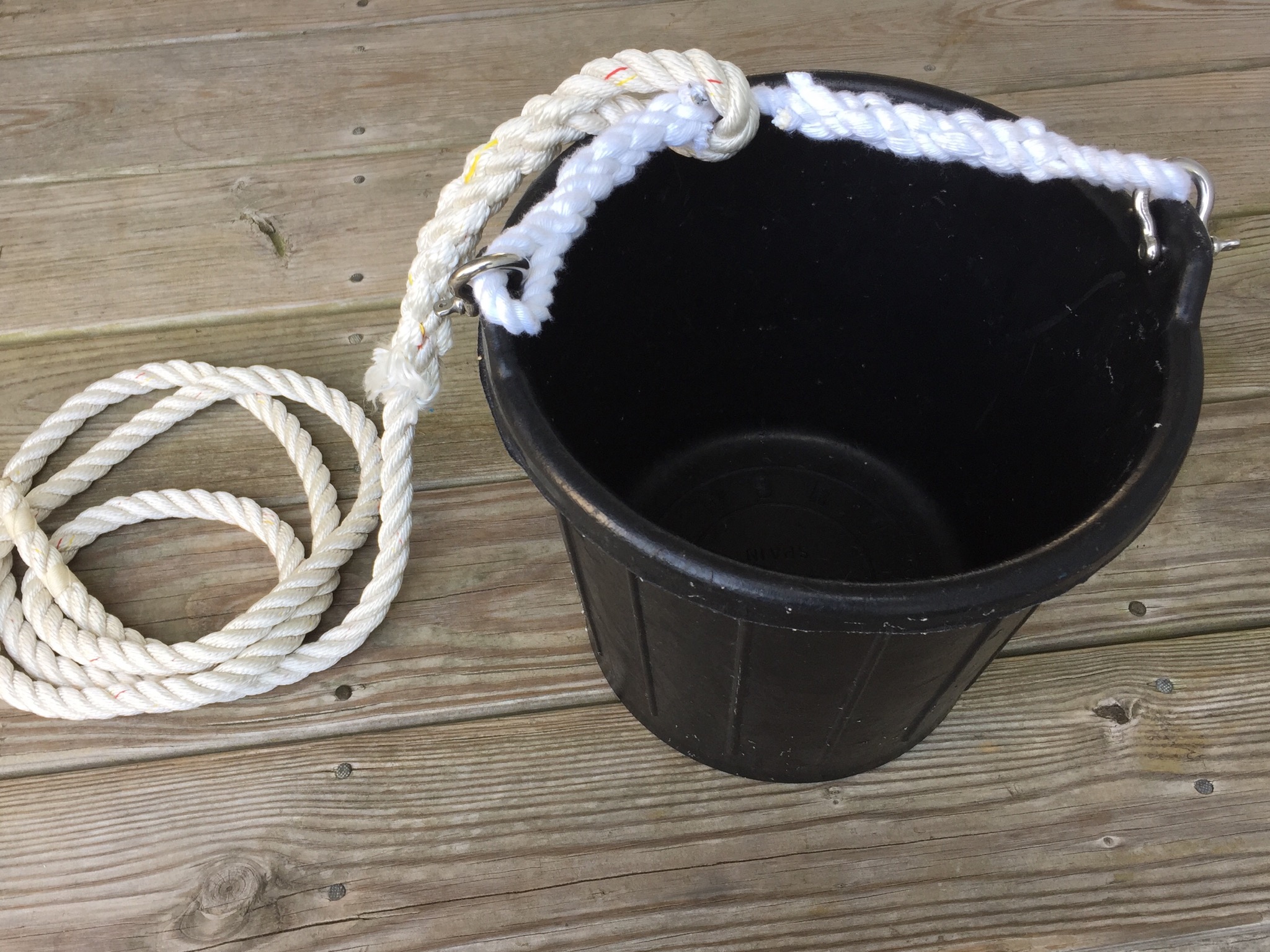 The bucket as used for the last two years. Pretty good but the SS shackles occasionally banged into the topside paint as well as the kiwi-grip when we turned the bucket upside down on the deck to dry.