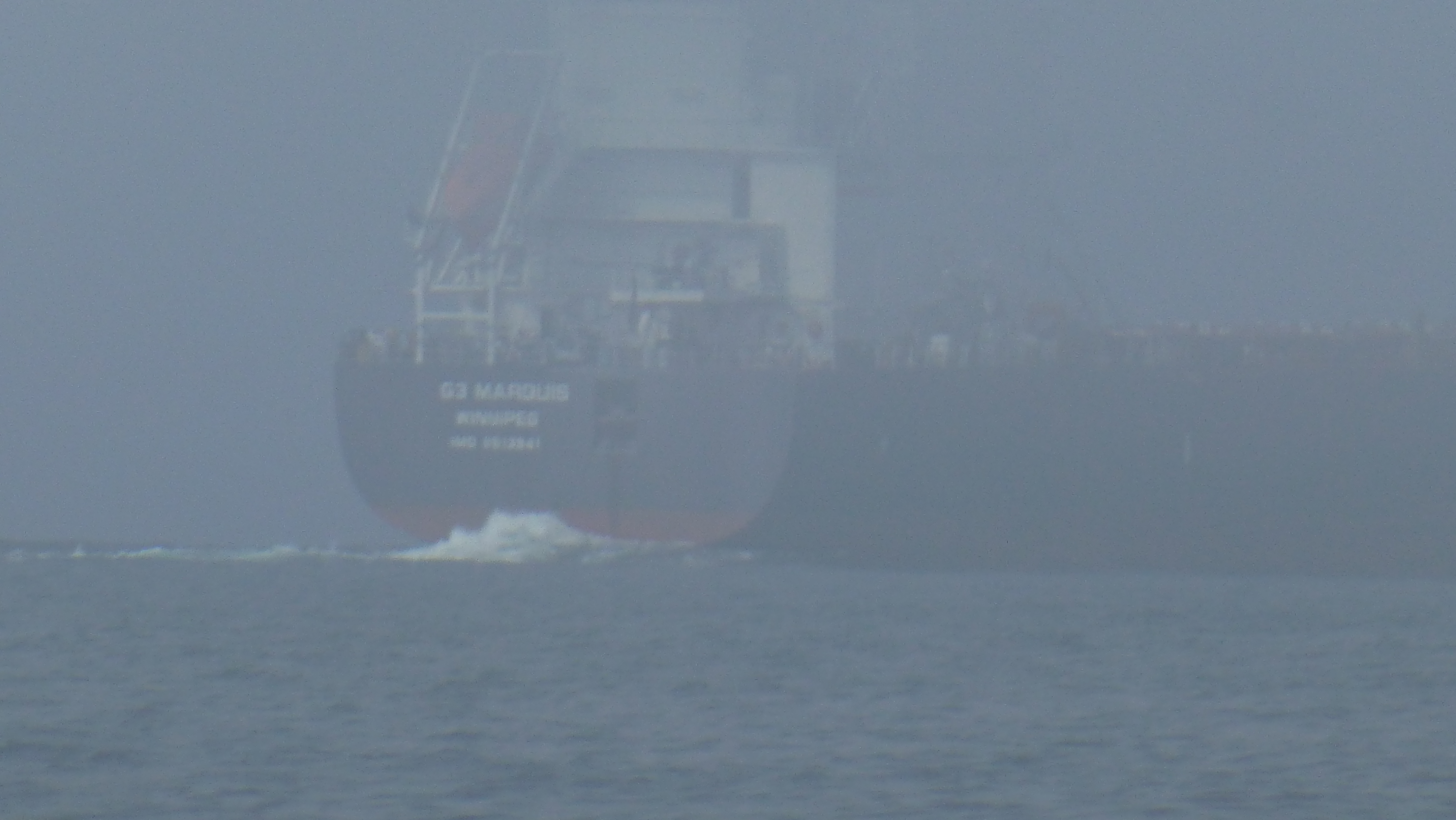 The ore carrier Marquis in the fog by Passage Island. Thanks AIS.