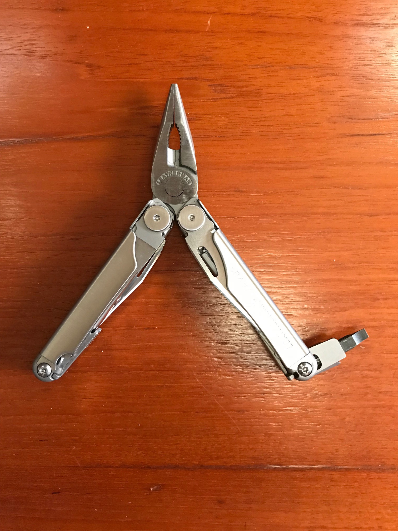 Leatherman with screwdriver accessory.