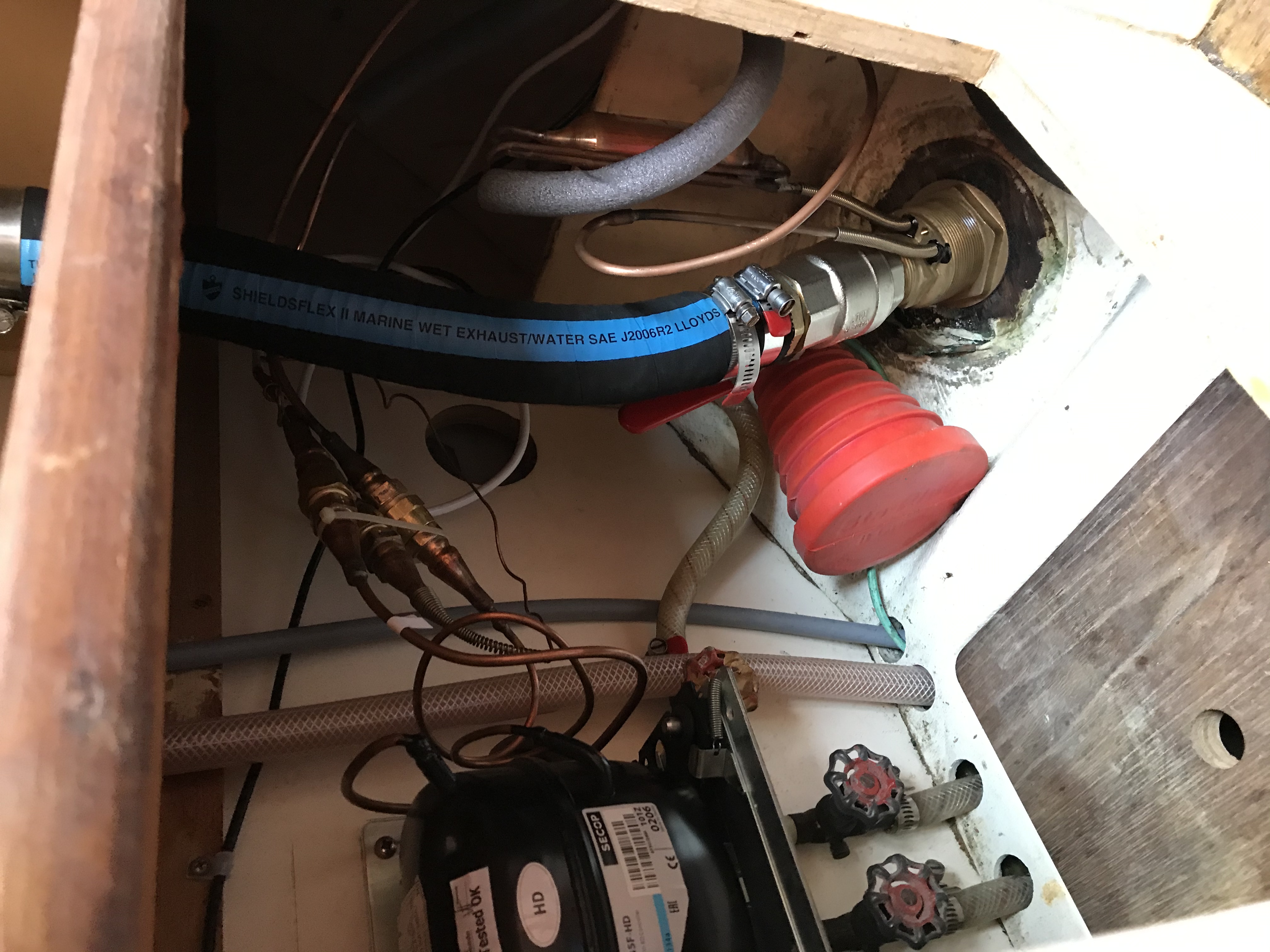 Compressor, new throughhull, new ball valve seacock, and new sink drain hose installation complete.