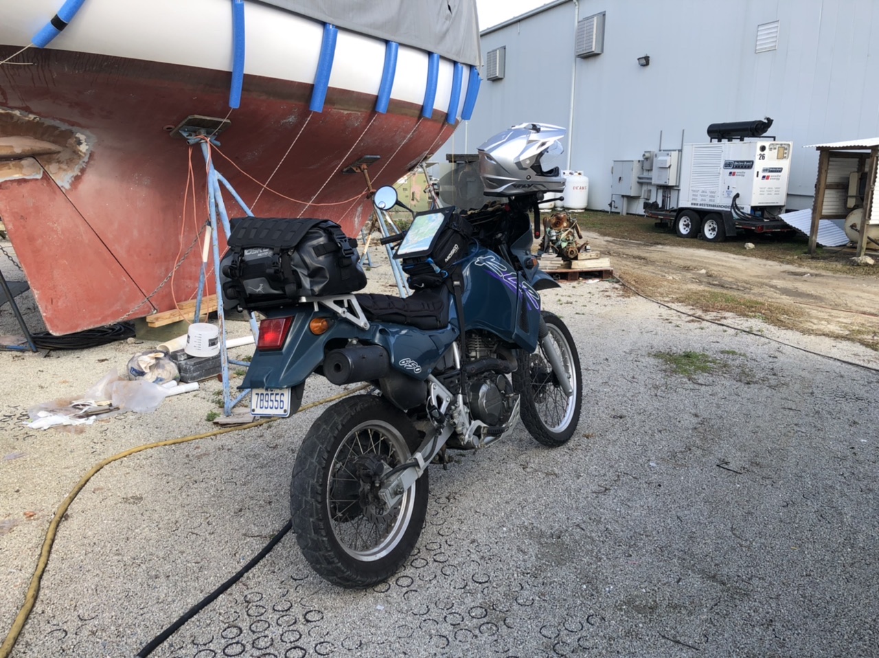 The KLR gets almost 60 mpg. It also allows me a little adventure cutting through the forest to get to the boatyard.