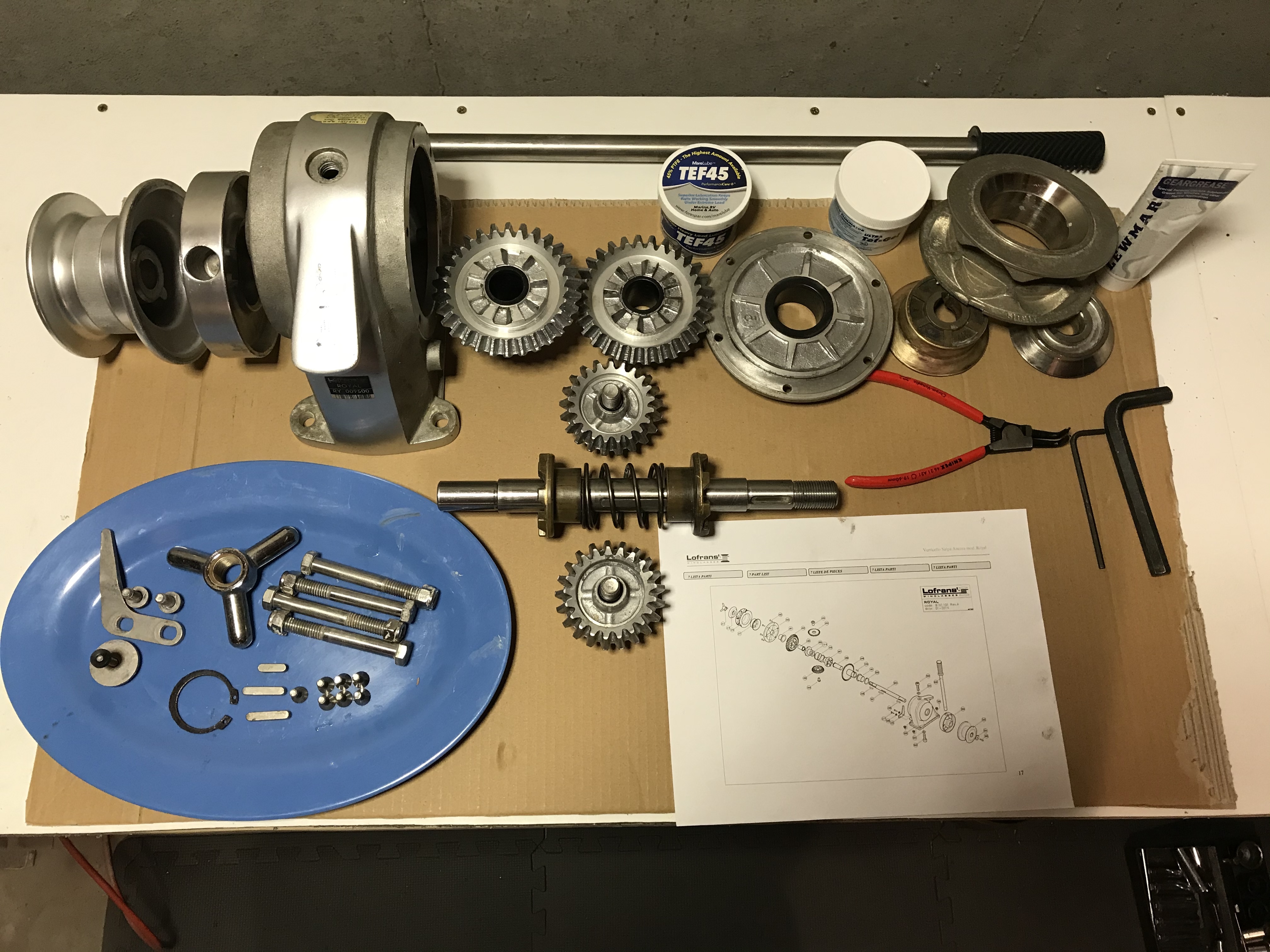 The windlass components laid out for reassembly.